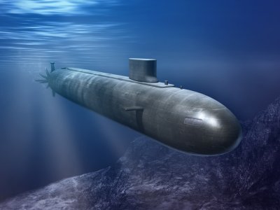 A grey aerodynamic submarine submerged in blue water